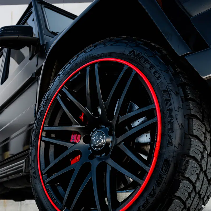 Red AlloyGator wheel rim protector installed on vehicle – Calgary